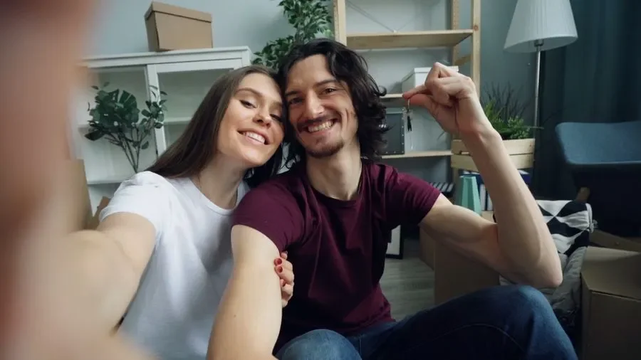 Couple holding up keys in their new home – residential locksmith Sheffield help for homeowners from Locksmith Sheffield